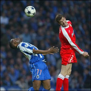 Benni McCarthy is unable to beat Romero to a high ball