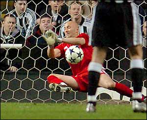 Marseille goalkeeper Fabien Barthez saves Alan Shearer's free-kick