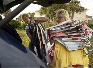 Residents load their van with clothes during evacuation on Pensacola Beach, Florida