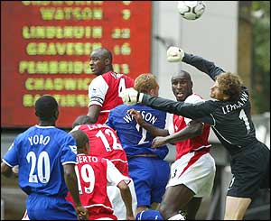Lehmann punches the ball clear for Arsenal in a dramatic season curtain-raiser