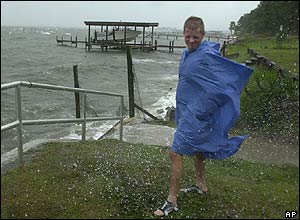 A boy braces himself against the wind at Fort Walton Beach, Florida