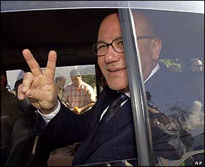 Turkish Cypriot Prime Minister Mehmet Ali Talat makes the V for victory sign after voting 