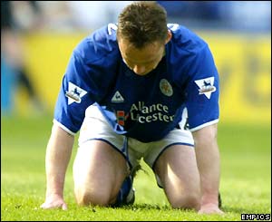 Paul Dickov sinks to his knees after missing a penalty