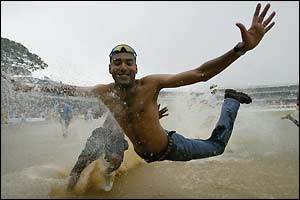 Cricket fans cavort in the outfield in Trinidad