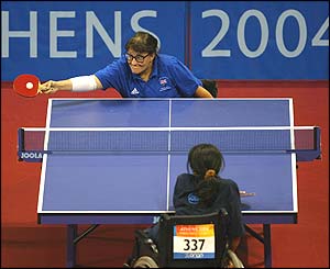 Cathy Mitton reaches for a return