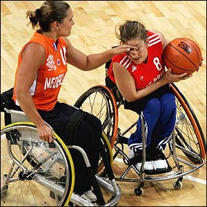 Wild shields the ball from Korver during Britain's wheelchair basketball victory