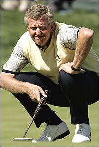 Montgomerie studies his putt on the first hole