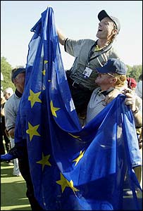 Langer is lifted in the air by Darren Clarke and Miguel Angel Jimenez