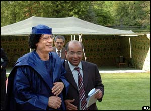 Col Gaddafi in front of a bedouin tent pitched in Brussels