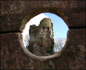 A picture of Llantrisant Castle, taken through the 600-year-old stocks near by (Stuart Osmundsen).