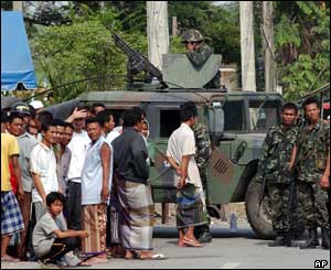 Tank in Pattani, surrounded by locals