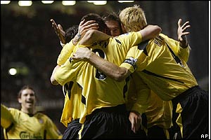 Liverpool players celebrate their equaliser