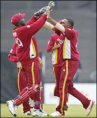 Courtney Browne congratulates Dwayne Bravo