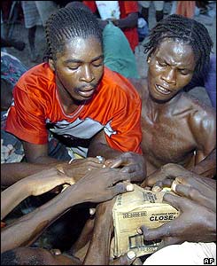 Residents of Gonaives fighting to get food supplies.
