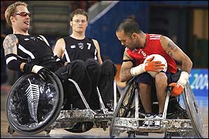 GB's Troye Collins (red) fights for the ball with New Zealand's Curtis Palmer (left)