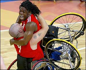 Ade Adepitan celebrates with Jon Pollock 
