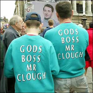 Forest fans wear green sweatshirts similar to those worn by Clough in his Forest heyday