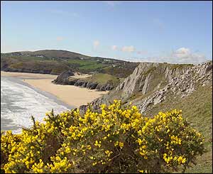 The Gower Coast from Pennard Cliffs overlooking Three Cliffs Bay, sent by Neil Lewis from the USA. 