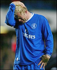 Eidur Gudjohnsen is left devastated at the end of the match as Chelsea crash out