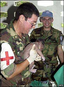 Two UN workers who have just delivered a baby in Gonaives. 