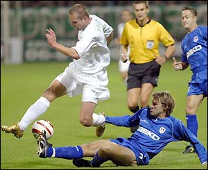 Robert Vagner is tackled but later scores as Ferencvaros open a 3-1 half-time lead