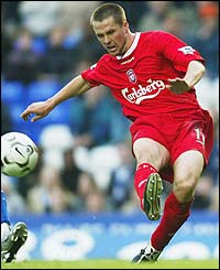 Michael Owen slots home the opener for Liverpool