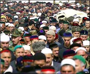 People gather on the streets of the Chechen village of Tsentoroi for the funeral