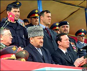 Ahmad Kadyrov (in hat) flanked by other top officials including regional commander Gen Valery Baranov (left)