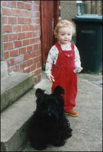 David Williams' daughter with the family's scottish terrier