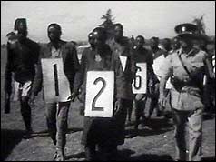 Mau Mau suspects wearing numbers round necks
