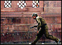 Police commando runs for cover (copyright: AP)