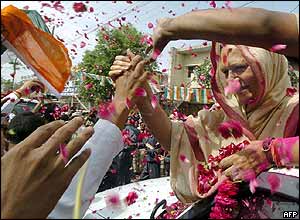 Supporters shower petals over Sonia Gandhi during the 2004 campaign