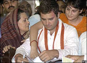 Rahul Gandhi submits candidacy papers with his mother Sonia, left, and sister Priyanka, right
