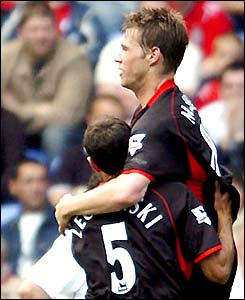 Fulham's Brian McBride celebrates a goal against Bolton