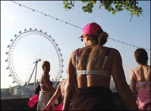 Bra-clad participants pass the London Eye