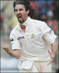 Jason Gillespie shows his joy at breaking up a useful partnership for India