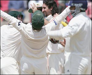 Jason Gillespie is surrounded by celebrating team-mates as Australia make the perfect start to their tour