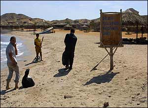 Cleaners on the beach