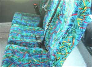 Three seats on each side of the coach