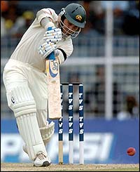 Justin Langer plays an attacking drive