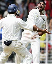 Harbhajan strikes again as Langer edges to slip