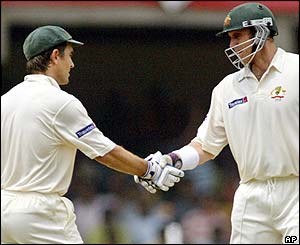 Langer is congratulated by Matthew Hayden after making his fifty
