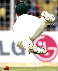 Simon Katich makes an unsuccessful attempt to catch Sehwag