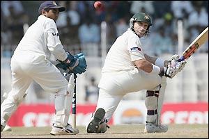 Matthew Hayden sends a shot past Parthiv Patel as the tourists look to cut the deficit