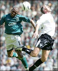 Celtic's Didier Agathe gets the better of Craig Brewster