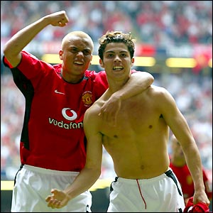 Wes Brown rushes to congratulate Ronaldo after the young Portuguese puts his side ahead just before half-time