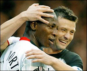 Luis Boa Morte is congratulated by Tomasz Radzinski 