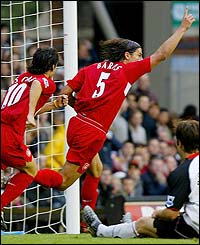 Milan Baros celebrates after Liverpool respond against Fulham