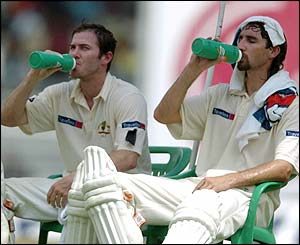 The Australian pair take some welcome refreshment 