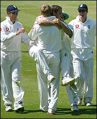 Simon Jones jumps into the arms of Andrew Flintoff after taking the wicket of New Zealand's Brendon McCullum